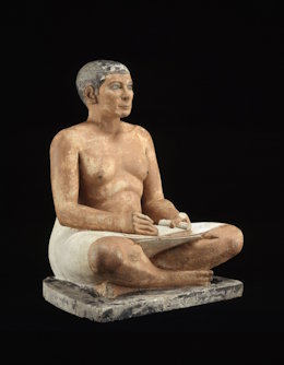 The crouching scribe is an Egyptian sculpture in Louvre Museum